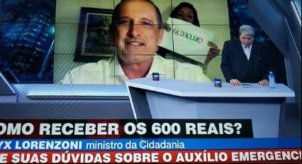 Filha invade entrevista de Onyx Lorenzoni a Datena com cartaz dizendo “Globo Lixo”